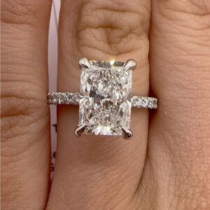 3.02 carat E VS1 radiant cut lab diamond on a pavé band engagement ring